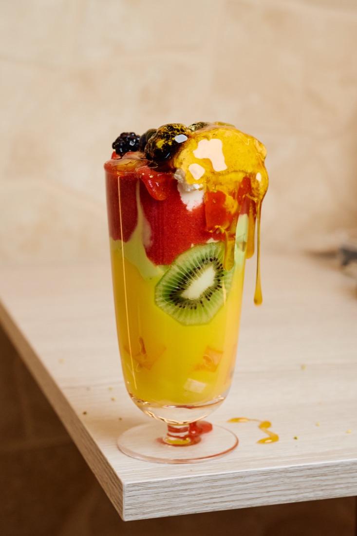 A URTH fruit cocktail layered with fresh fruit