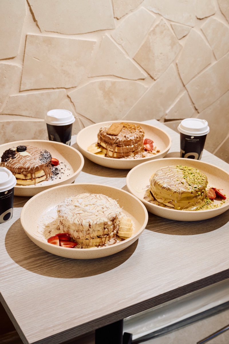 A selection of URTH pancakes and crêpes served with fruit