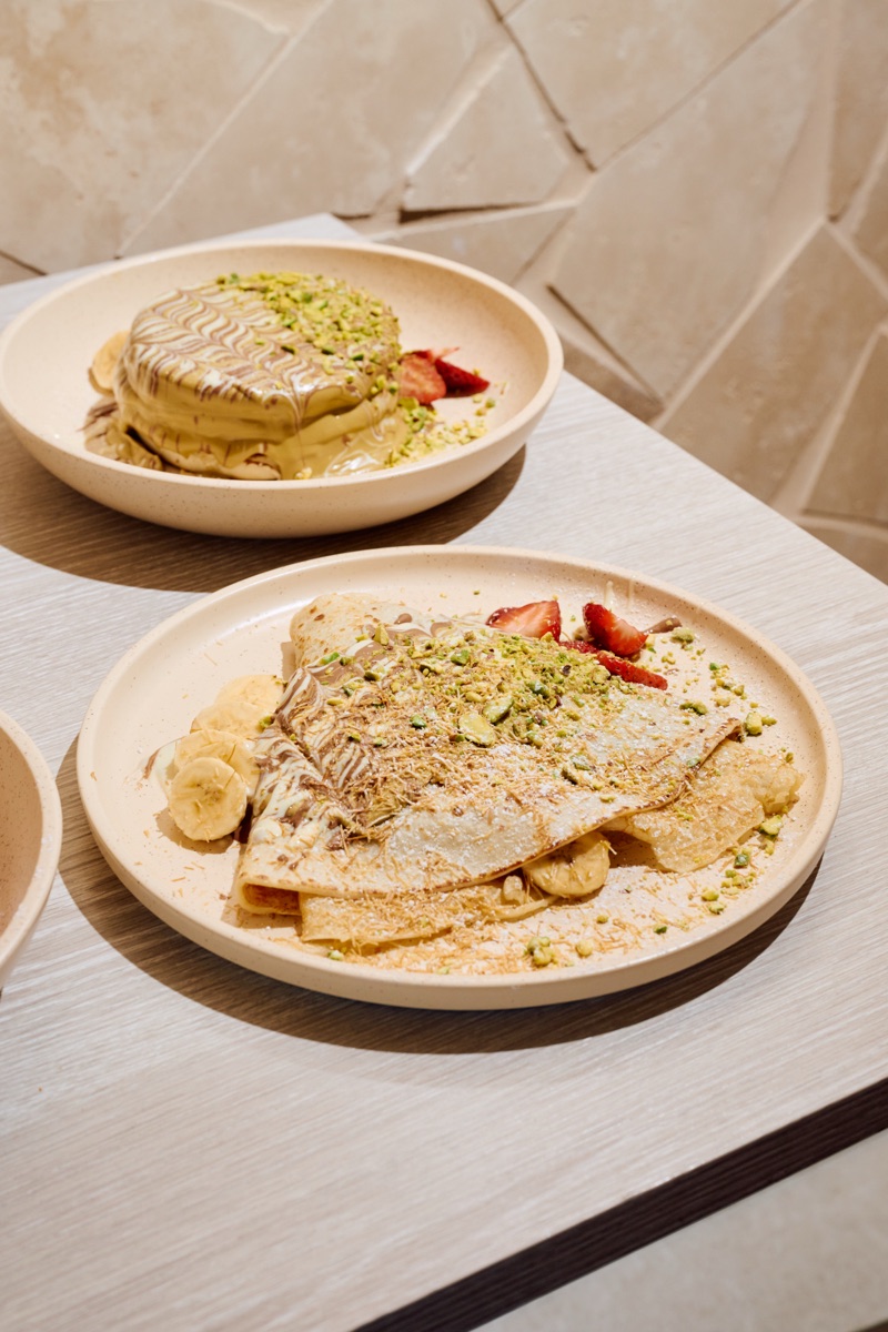 A selection of URTH pancakes and crêpes served with fruit