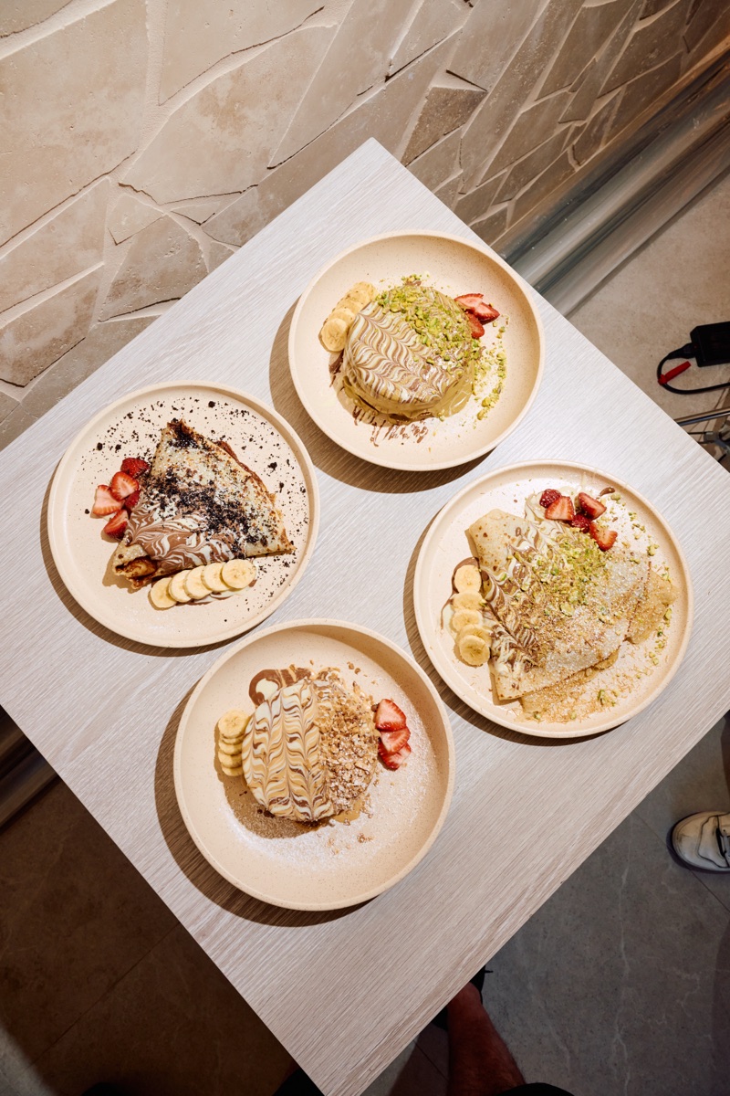 A selection of URTH pancakes and crêpes served with fruit